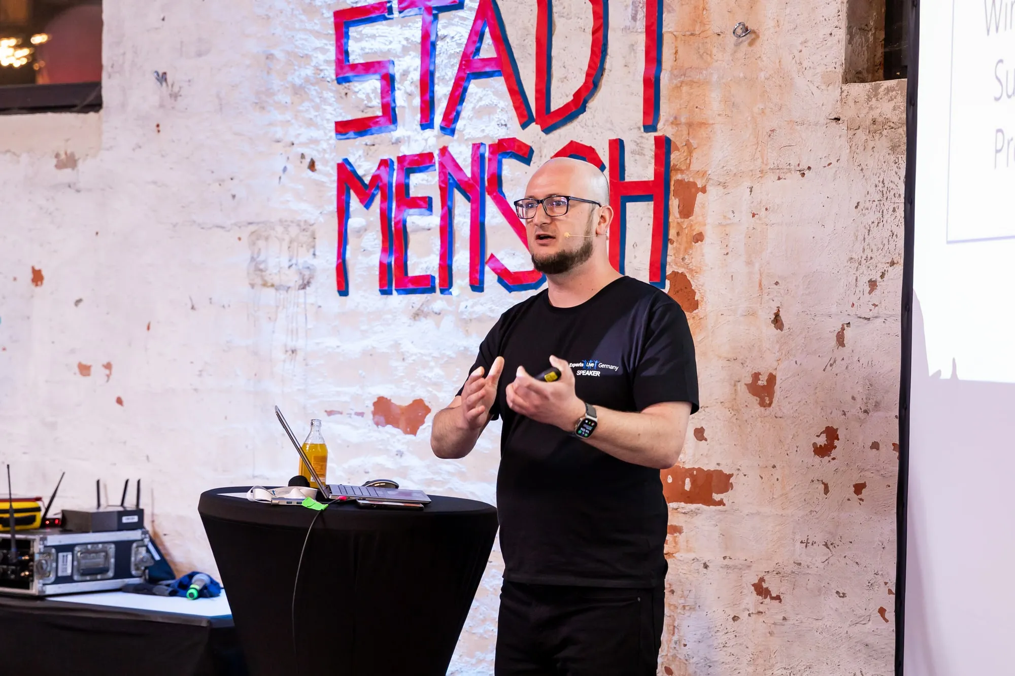 Talk in front of the graffiti wall at Experts Live Germany 2024