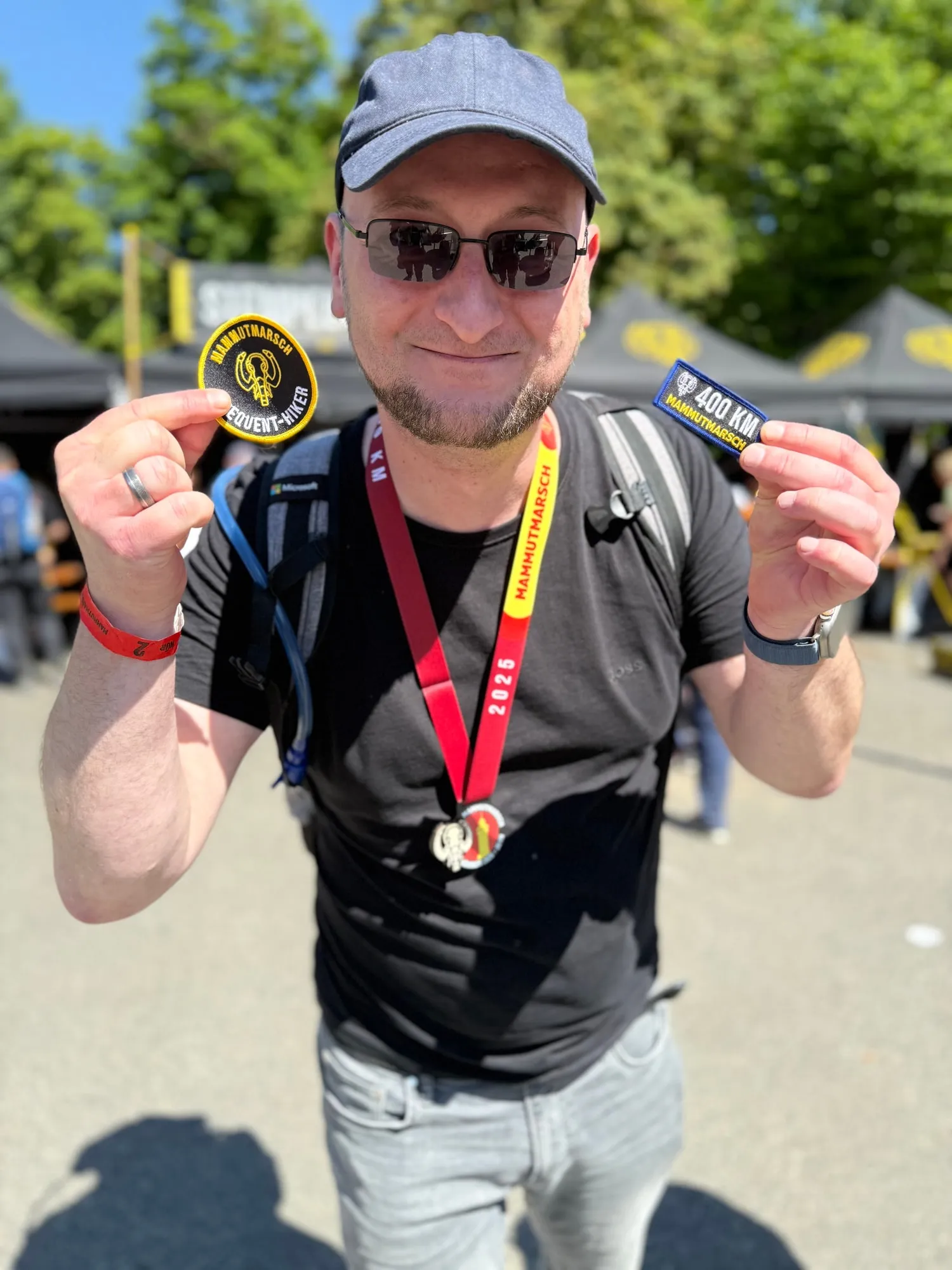 Christoph with medal and 400 km patch after the Mammutmarsch Nürnberg 2025